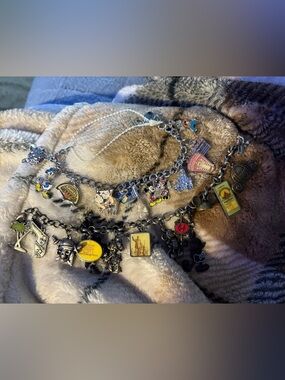 Disney charm bracelets two sets please look at pictures! One is older